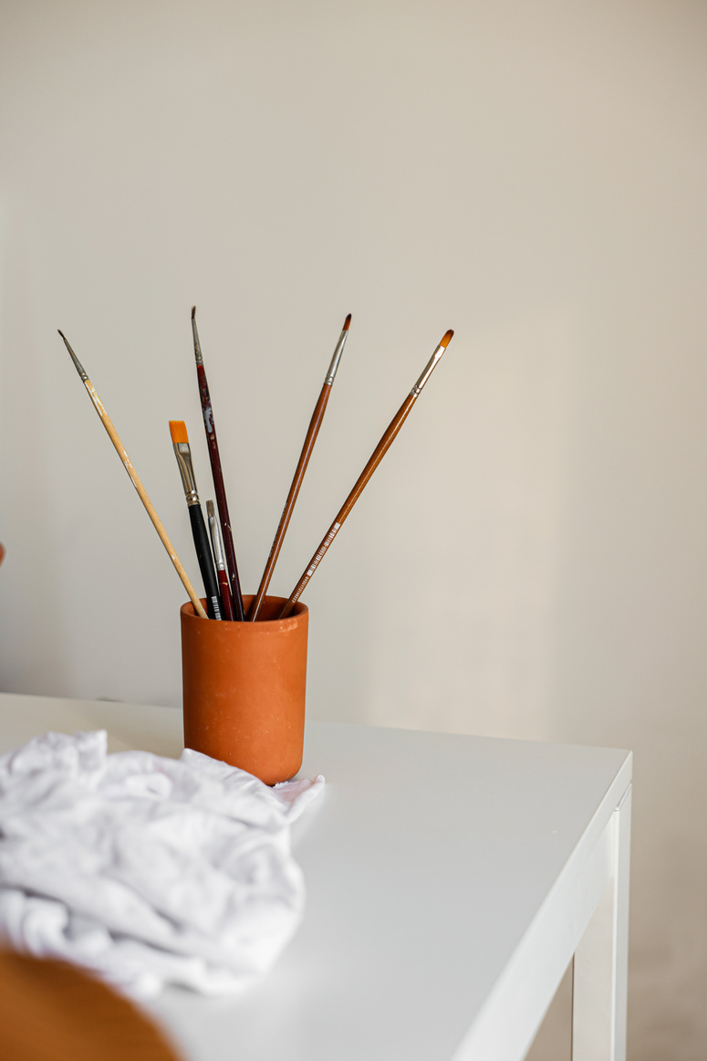 Paintbrushes on the Brown Cup